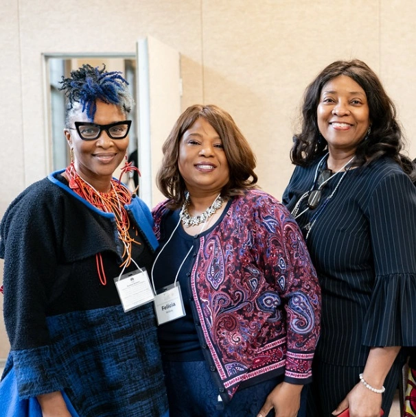 Keynote speaker enjoys a moment with other Douglass alumnae at the AADC Black Alumnae Network conference.