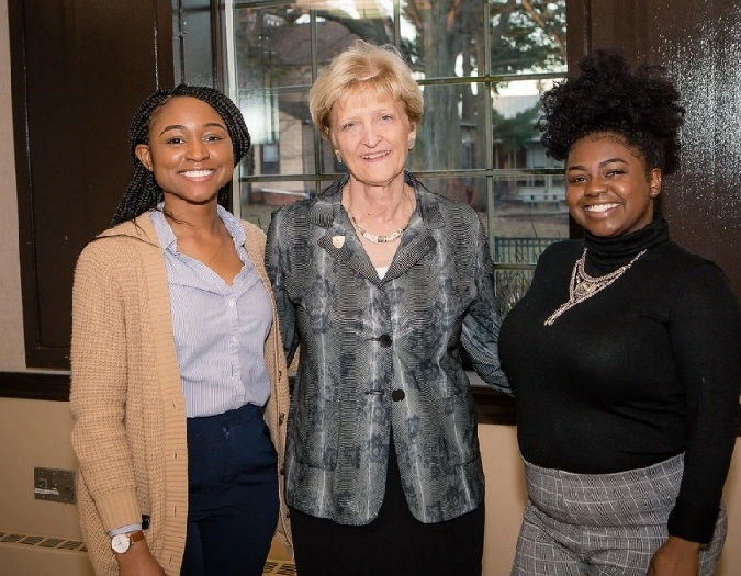 Young Alumnae Network members post with speaker at the Douglass Alumnae Zagoren Lecture hosted in Douglass College Student Center at Rutgers University.