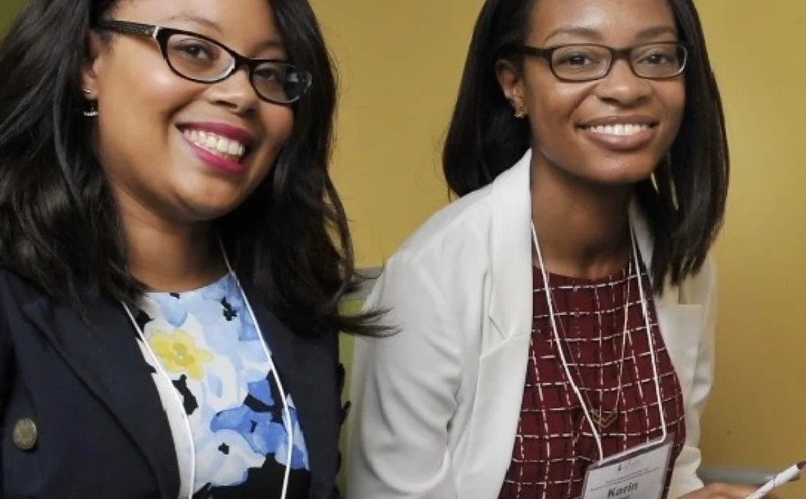 Two women ready to take notes at at AADC Mentorship event